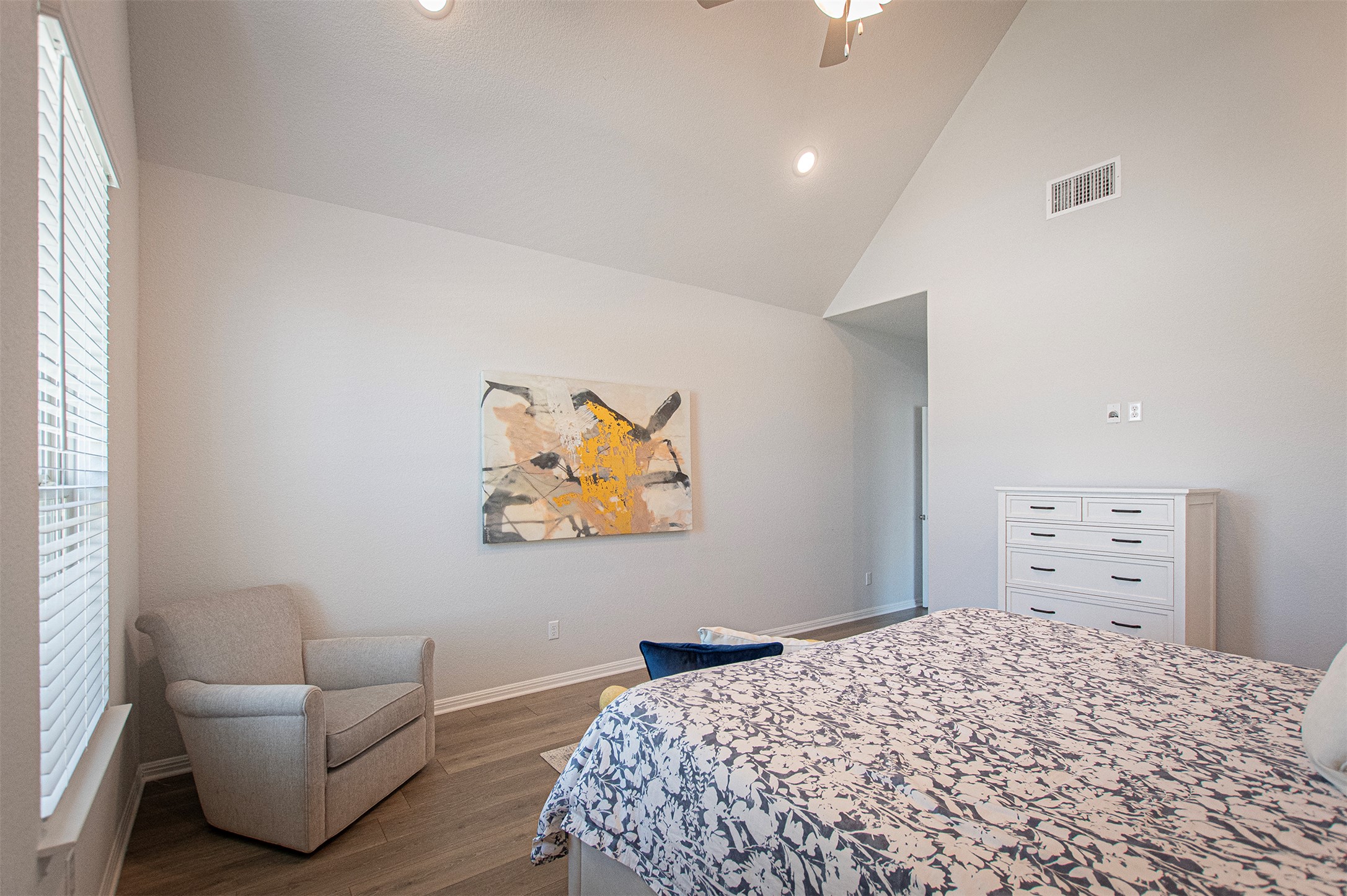 249 Treadwell Lane Kyle, TX 78640 - Photo 16 of 26 a bedroom with a bed and dresser
