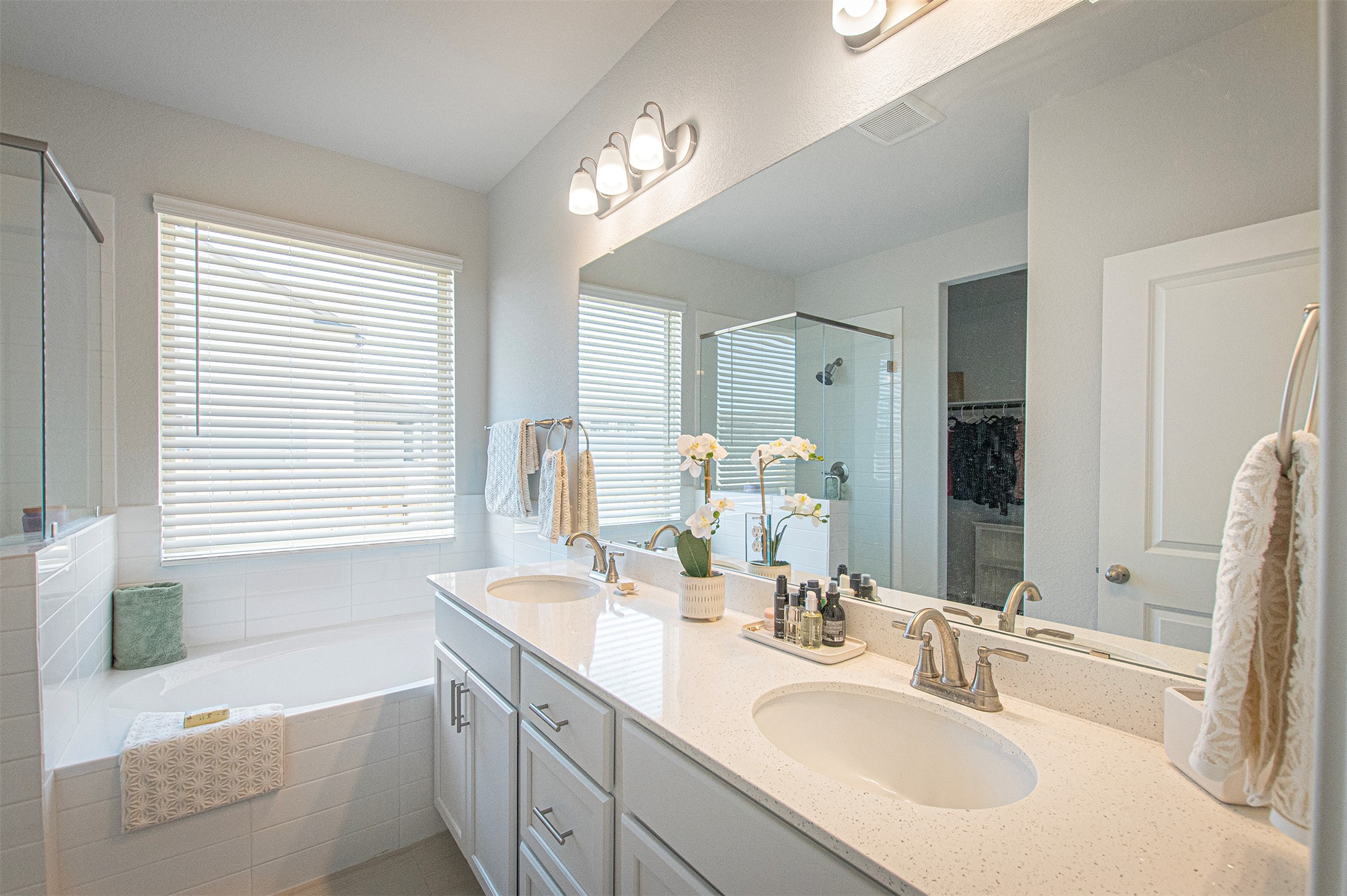 249 Treadwell Lane Kyle, TX 78640 - Photo 17 of 26 a bathroom with a sink double vanity granite tub shower and a mirror