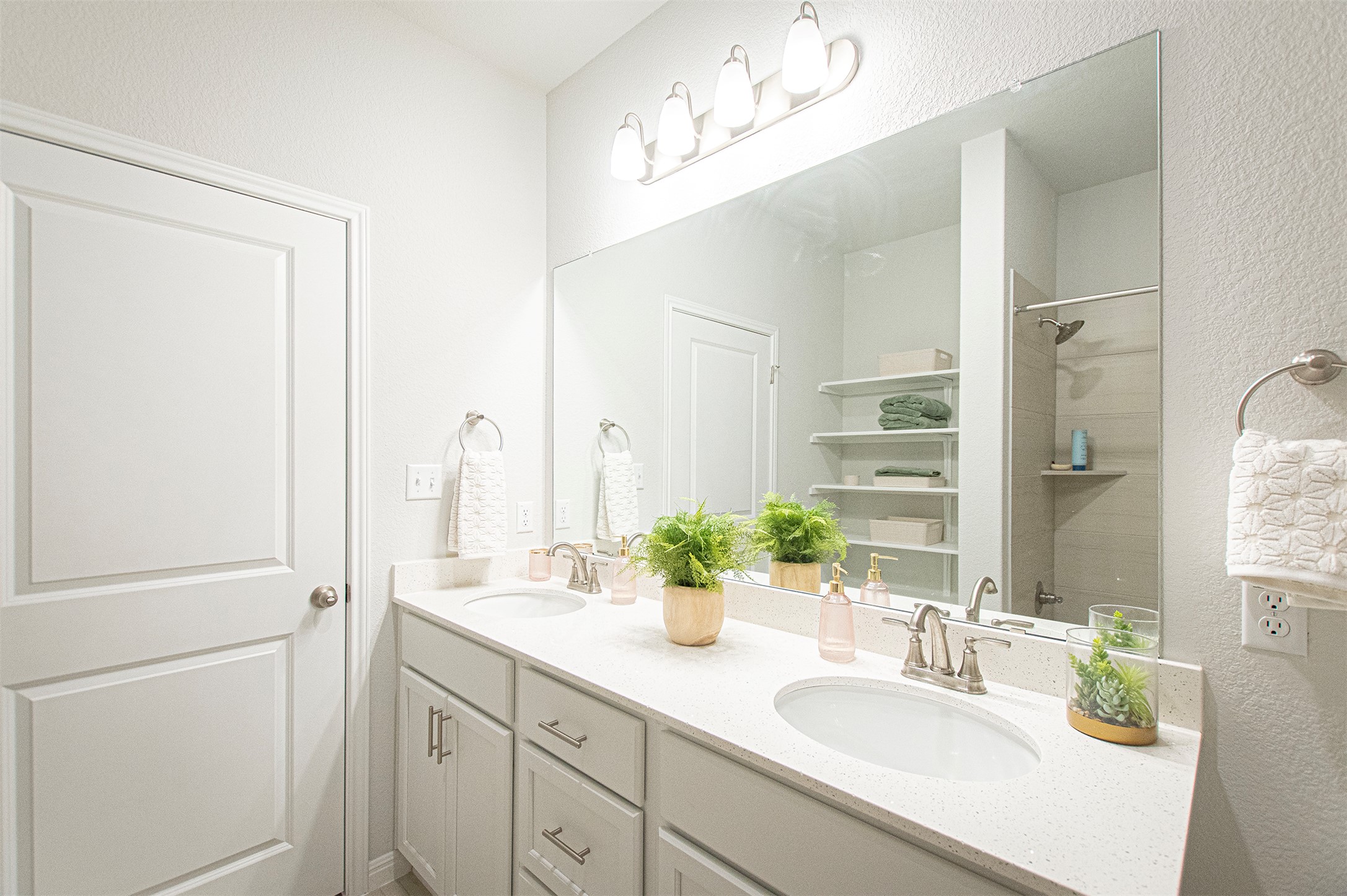 249 Treadwell Lane Kyle, TX 78640 - Photo 22 of 26 a bathroom with a double vanity sink and a mirror