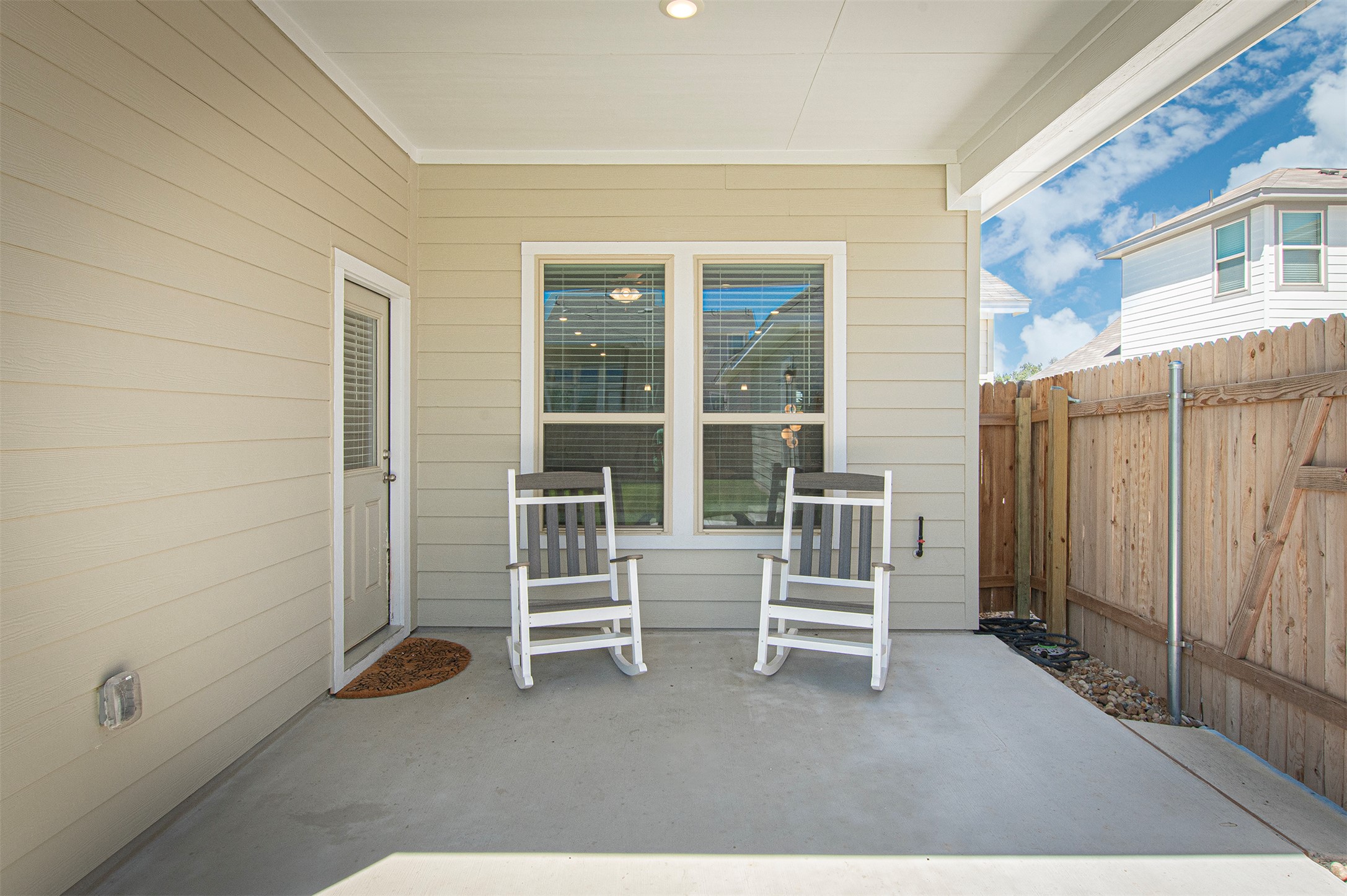 249 Treadwell Lane Kyle, TX 78640 - Photo 23 of 26 a view of chairs and door in a room