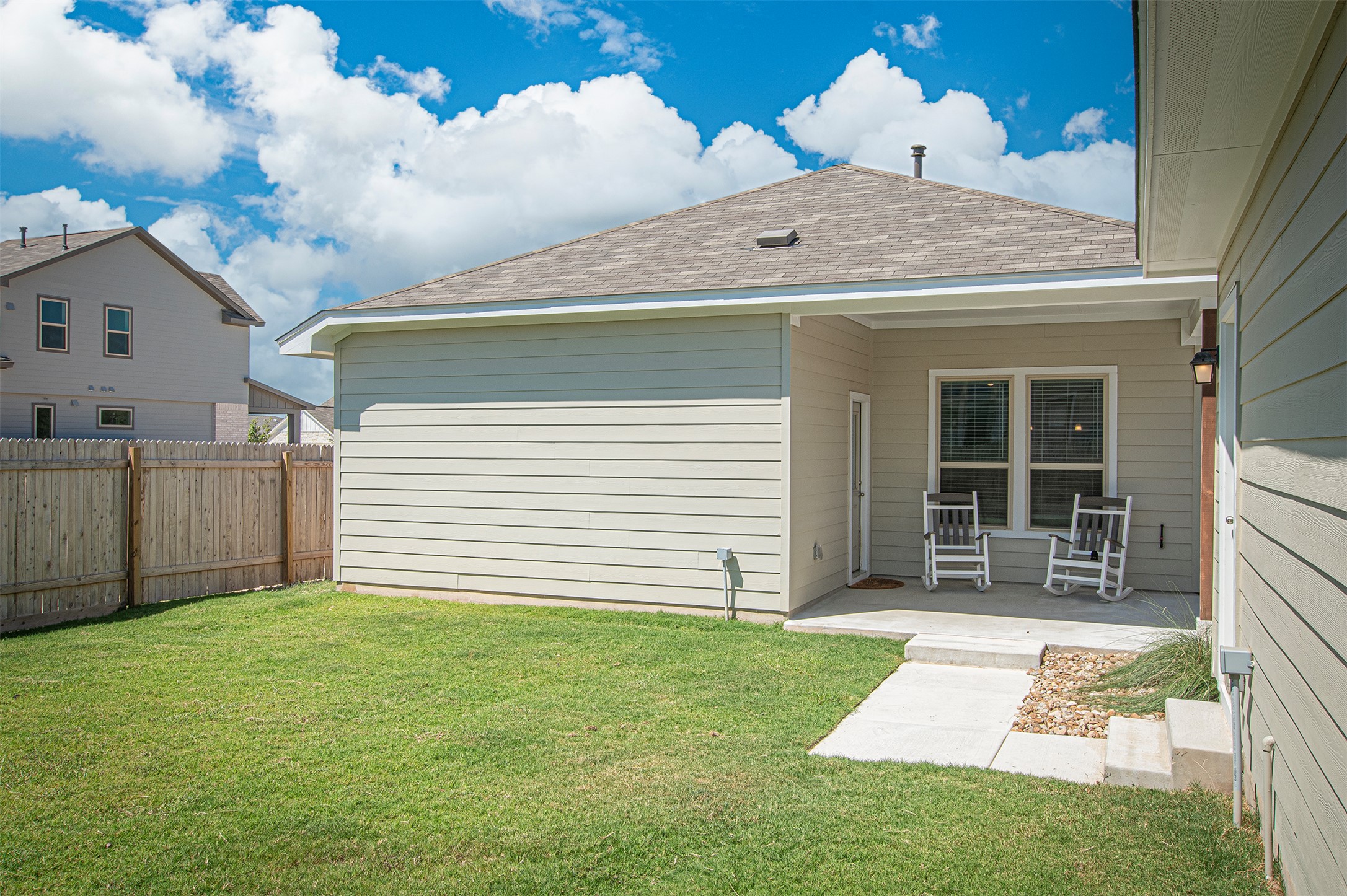 249 Treadwell Lane Kyle, TX 78640 - Photo 25 of 26 a front view of a house with garden