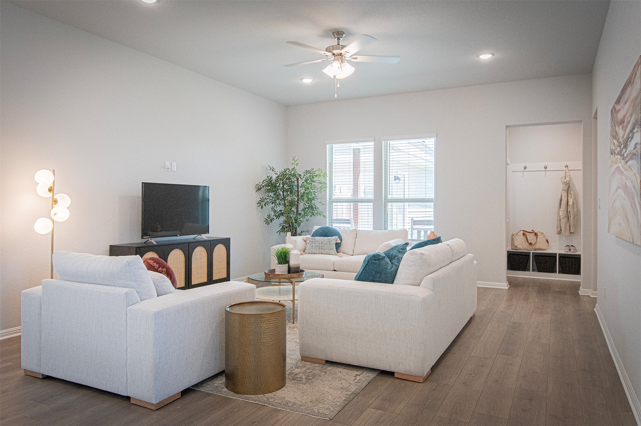 249 Treadwell Lane Kyle, TX 78640 - Photo 4 of 26 a living room with furniture and a flat screen tv