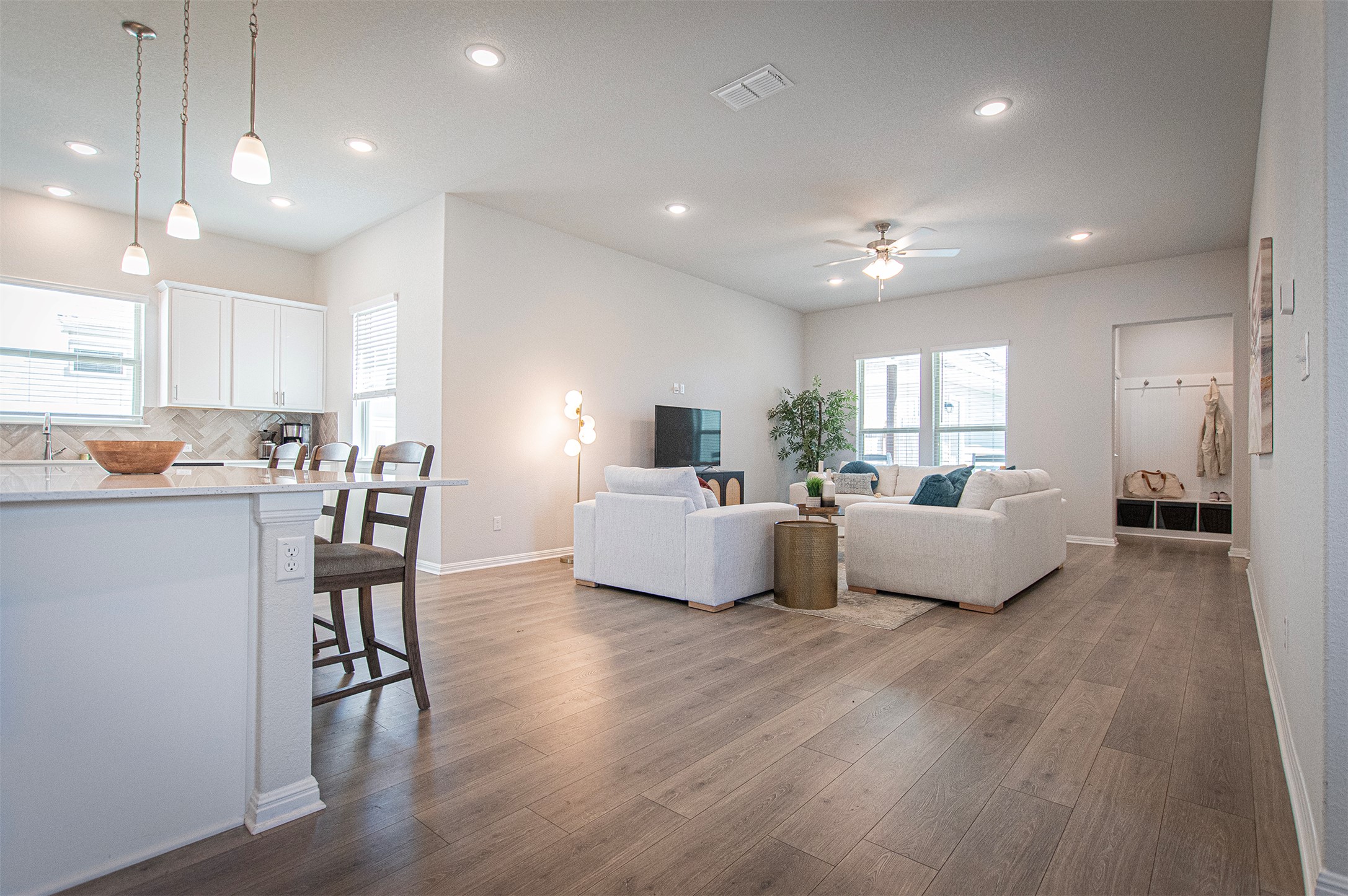 249 Treadwell Lane Kyle, TX 78640 - Photo 7 of 26 a living room with furniture and a wooden floor