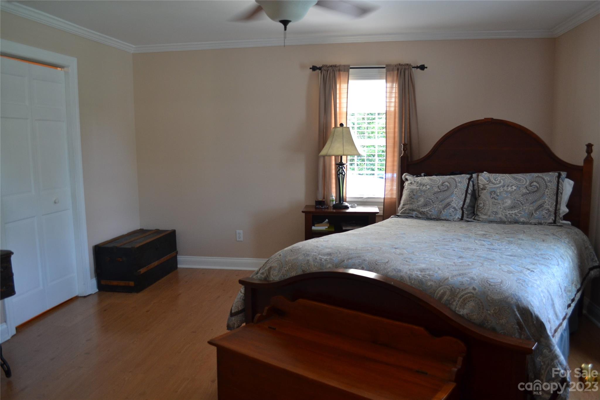 109 Tucker Street Locust, NC 28097 - Photo 11 of 13 a bedroom with a bed and a window