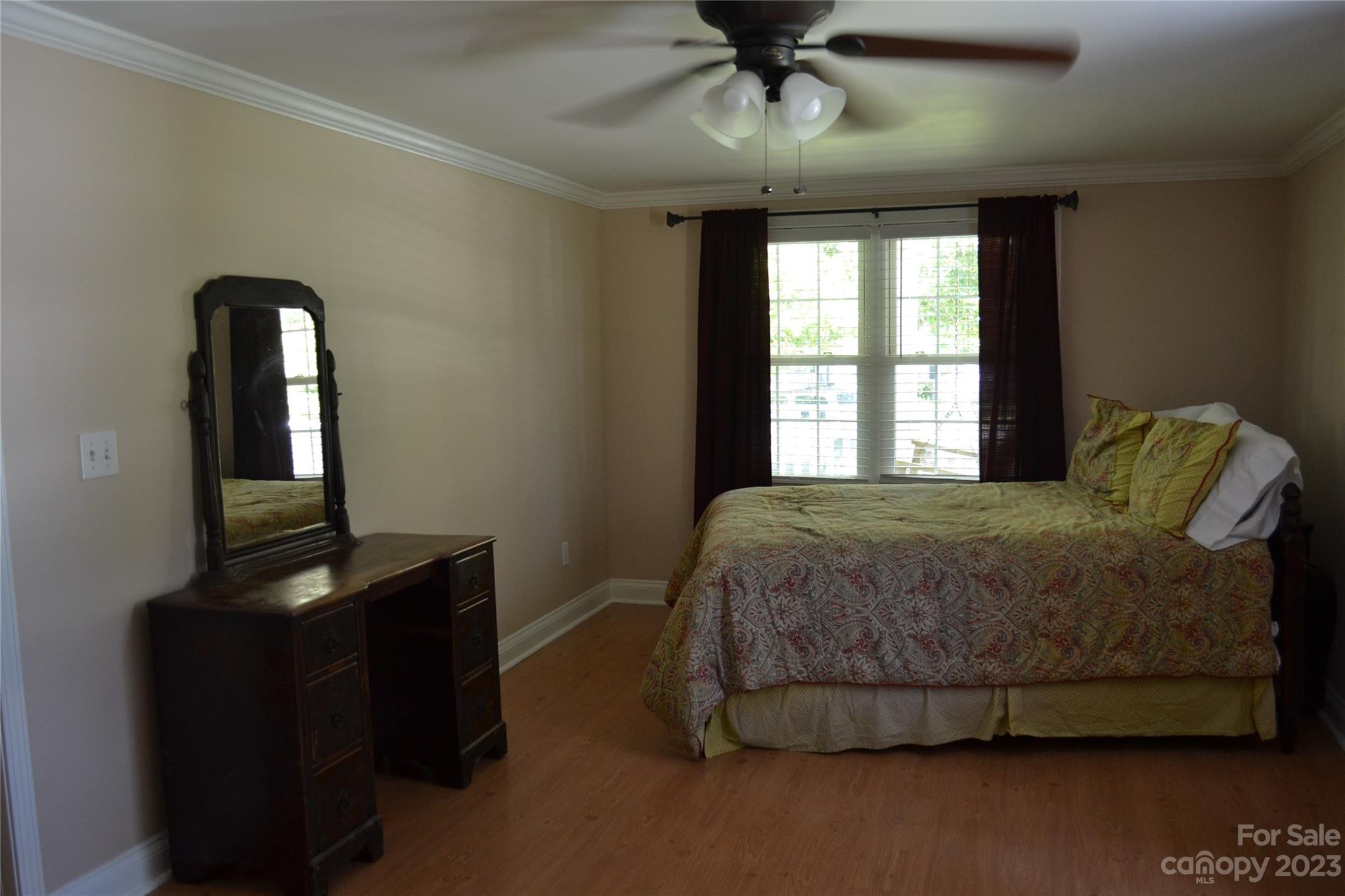 109 Tucker Street Locust, NC 28097 - Photo 12 of 13 a bedroom with a bed and a desk