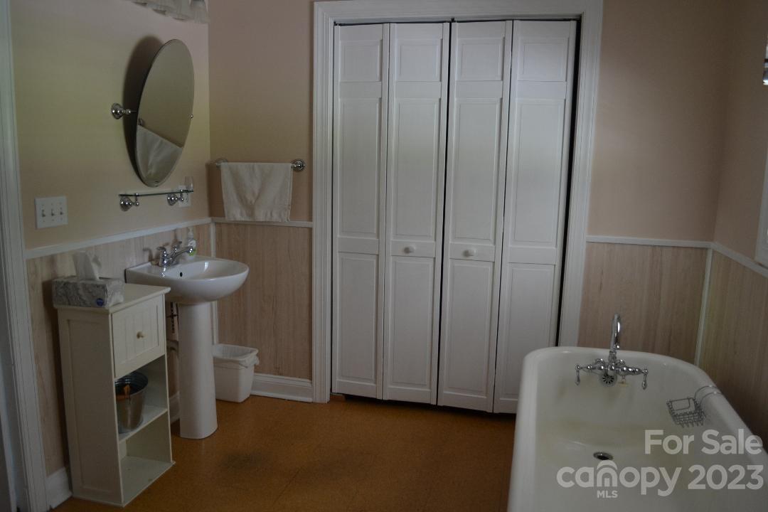 109 Tucker Street Locust, NC 28097 - Photo 13 of 13 a bathroom with a sink a toilet and tub