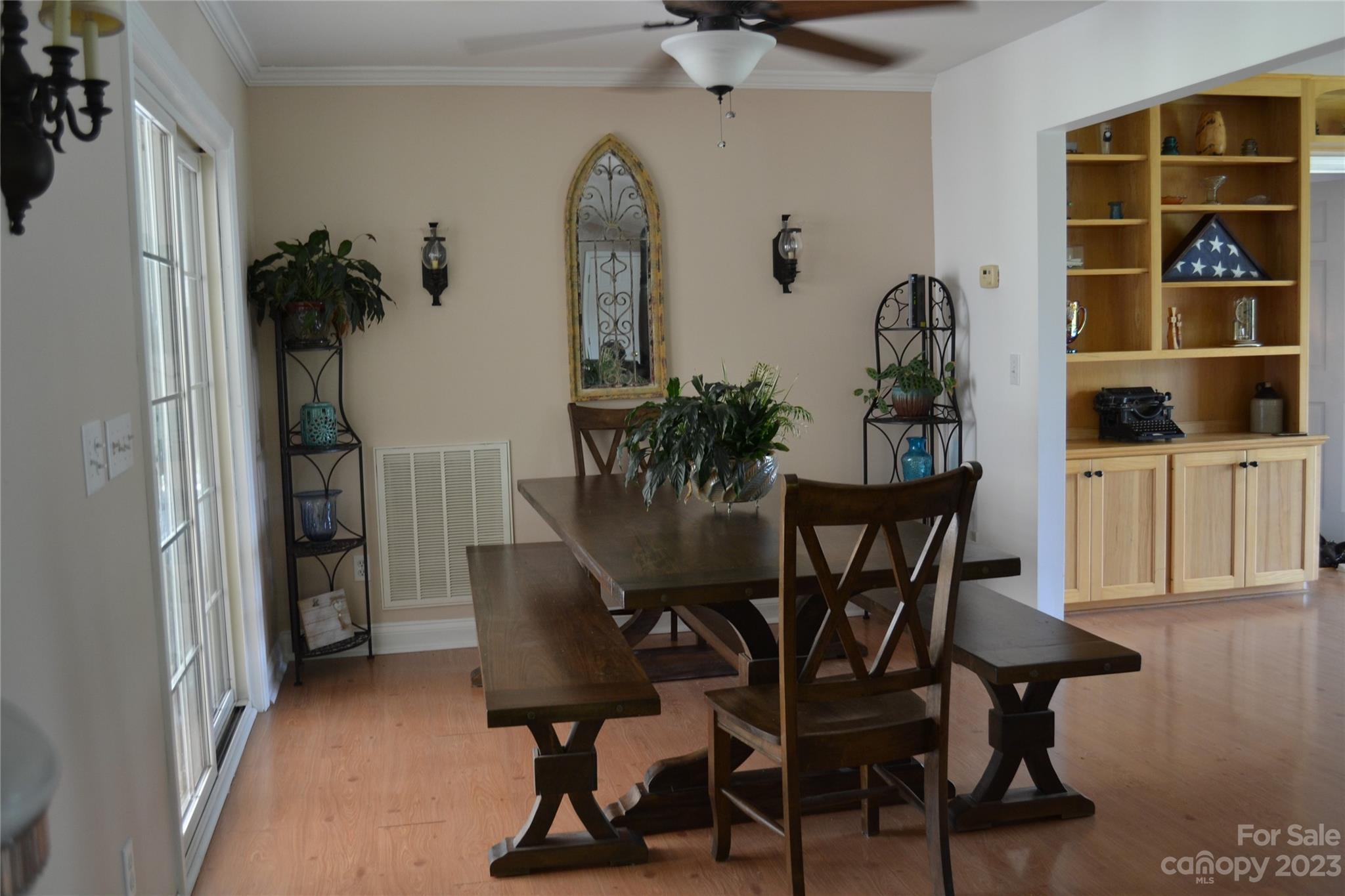 109 Tucker Street Locust, NC 28097 - Photo 5 of 13 a view of a dining room with furniture and wooden floor
