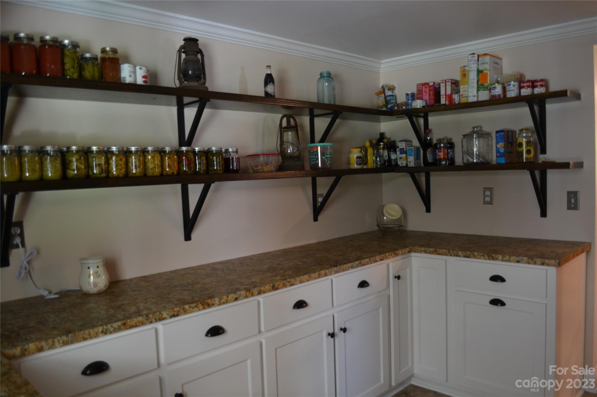 109 Tucker Street Locust, NC 28097 - Photo 9 of 13 a kitchen with cabinets and window