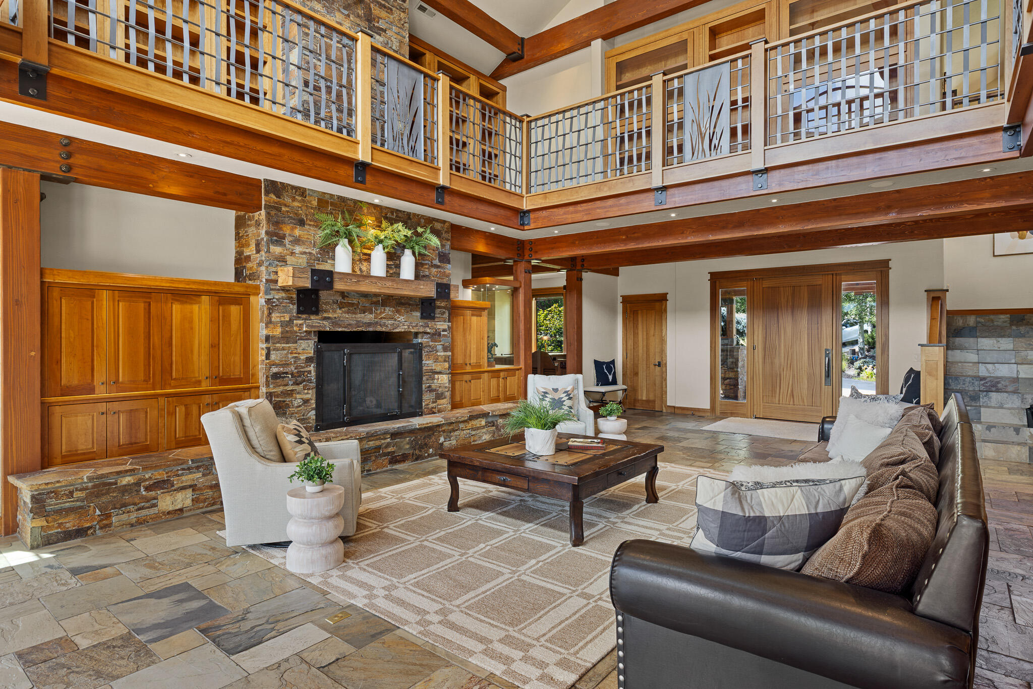 18883 Sutherland Court Bend, OR 97702 - Photo 6 of 70 Volume and warmth combine in a great room that opens to an upper library?a space designed for both grand entertaining and quiet reflection.