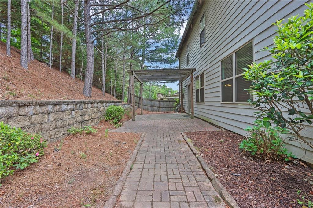 1515 Riva Ridge Suwanee, GA 30024 - Photo 33 of 35 a backyard of a house with lots of green space