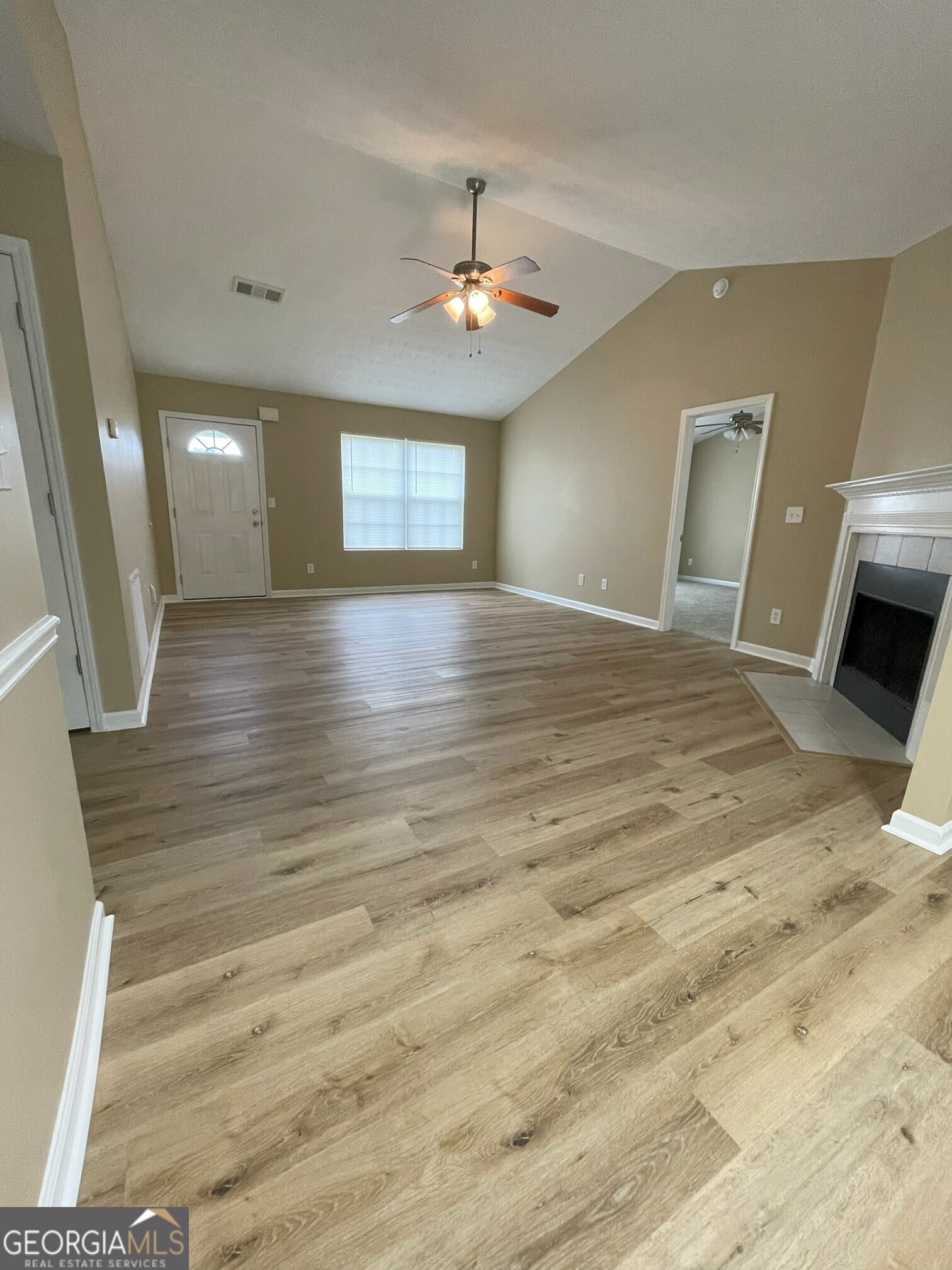 134 Cemetary Road Luthersville, GA 30251 - Photo 7 of 18 wooden floor in an empty room with a window