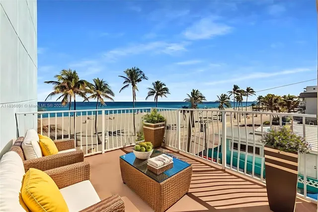 a view of a balcony with furniture