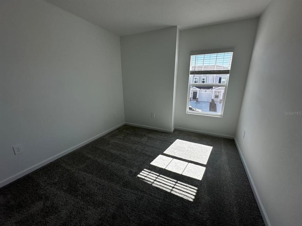 2713 Skyline Loop Kissimmee, FL 34758 - Photo 12 of 20 a view of wooden floor in a room