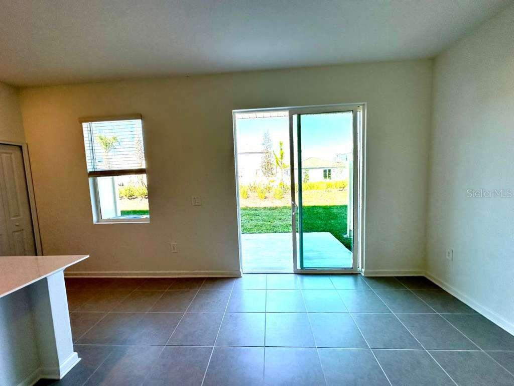2713 Skyline Loop Kissimmee, FL 34758 - Photo 3 of 20 a view of an empty room with a window