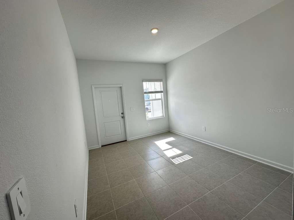 2713 Skyline Loop Kissimmee, FL 34758 - Photo 7 of 20 a view of empty room with window