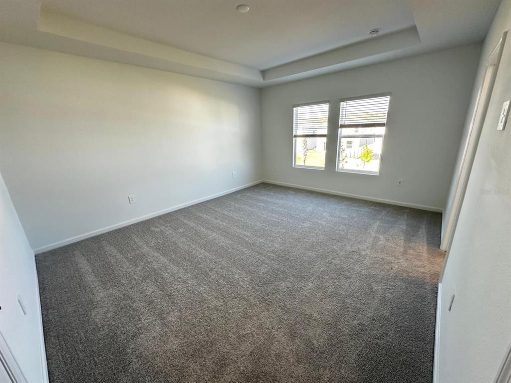 2713 Skyline Loop Kissimmee, FL 34758 - Photo 9 of 20 an empty room with a window