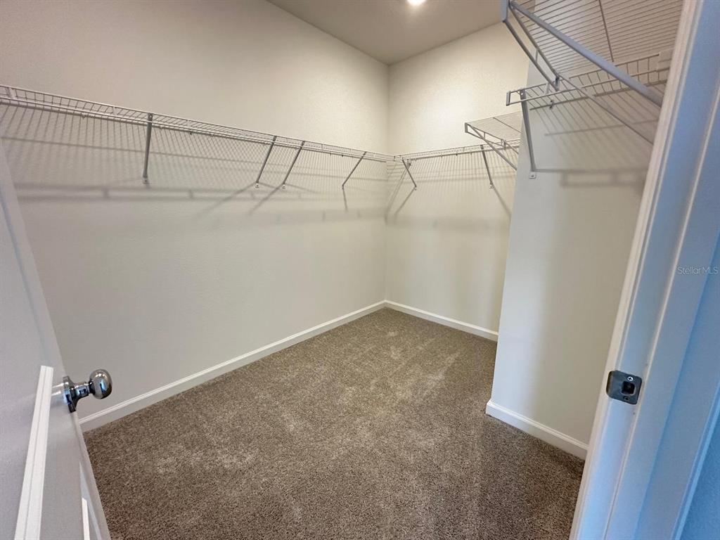 2713 Skyline Loop Kissimmee, FL 34758 - Photo 10 of 20 a view of a room with racks on the wall