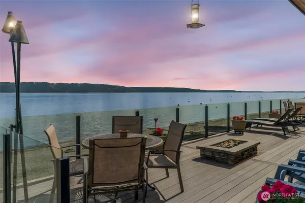 a view of a patio with furniture and a fireplace
