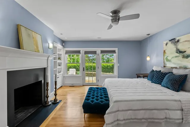 a bedroom with a bed and a fireplace