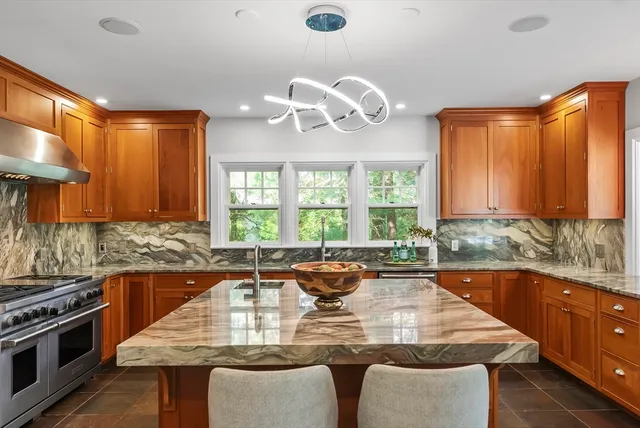 a kitchen with a stove a sink and a refrigerator