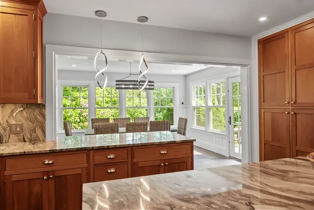 a room with a bed and a large window