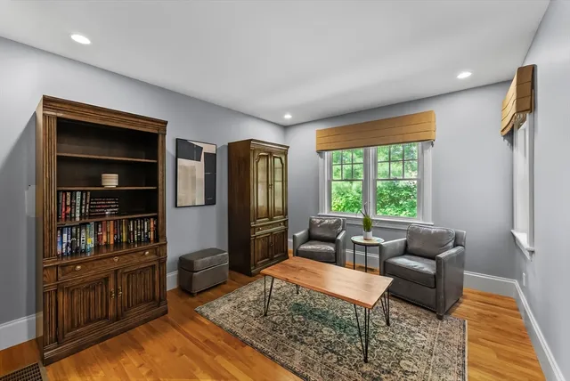 a living room with furniture and a rug