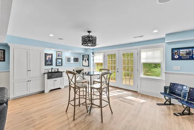 a dining room with furniture window wooden floor
