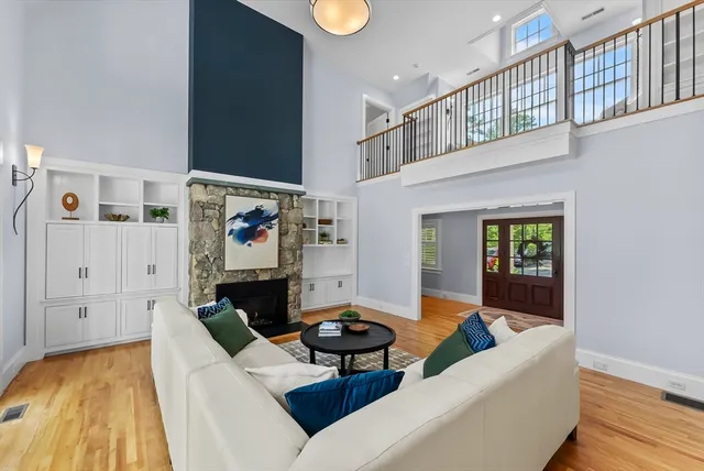 a living room with furniture and a rug