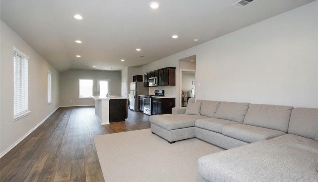 2354 Otter Falls Drive Spring, TX 77373 - Photo 3 of 9 a living room with furniture and a wooden floor