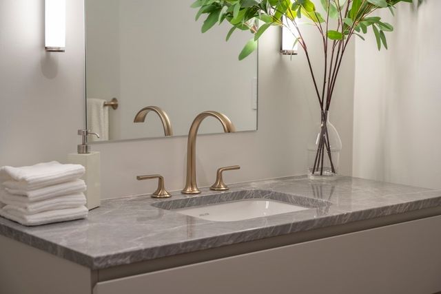a blue bench sitting in front of a building