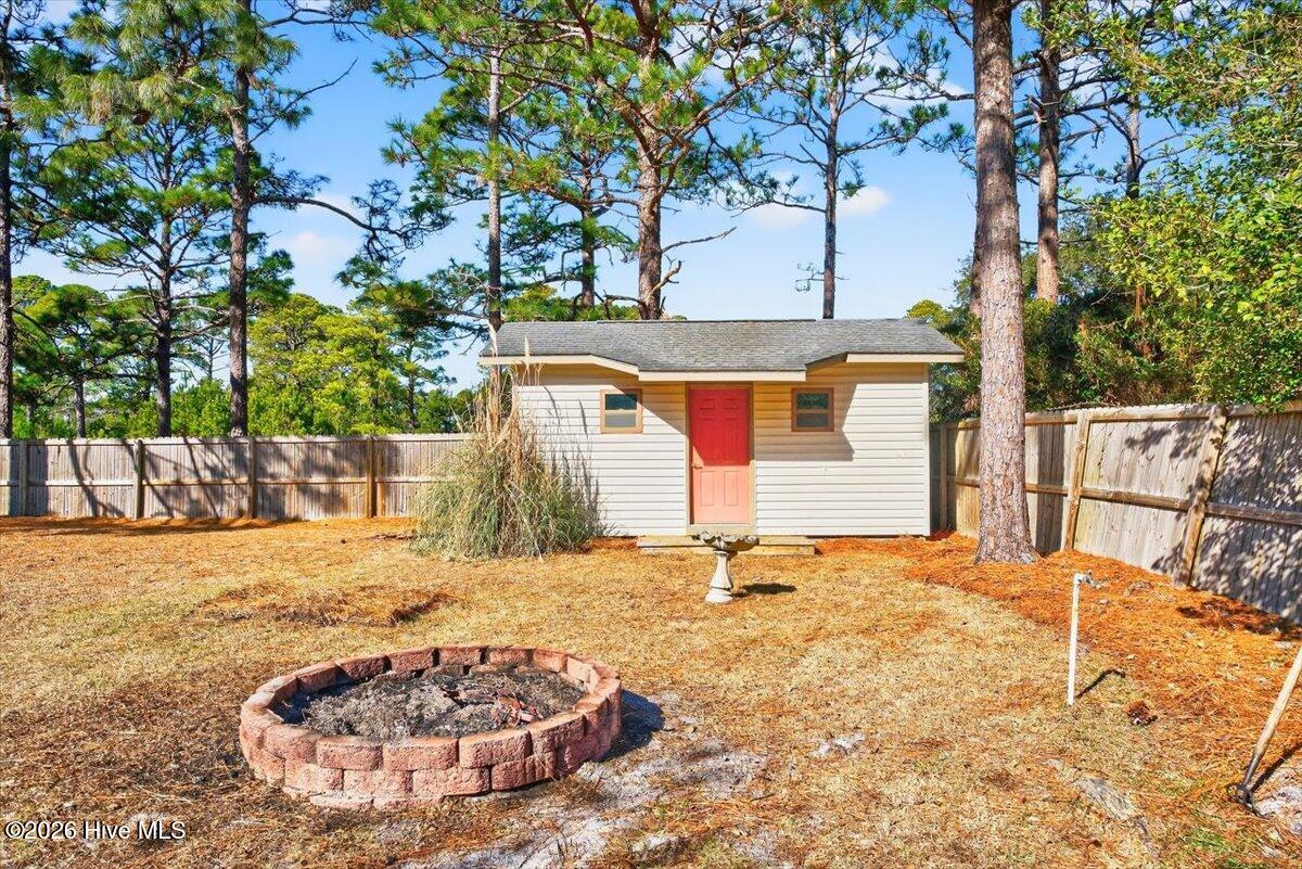 18 Brierwood Road Southwest Shallotte, NC 28470 - Photo 49 of 70 Outdoor fire pit area—perfect for gathering with friends and family year-round.