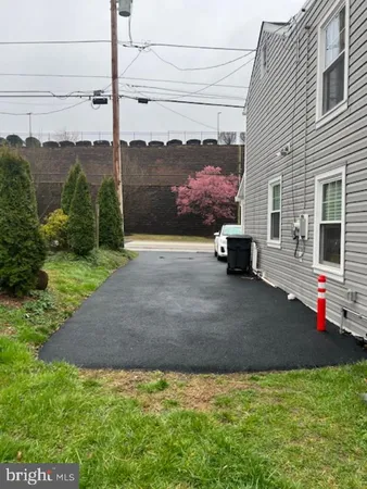 a view of a pool with a yard