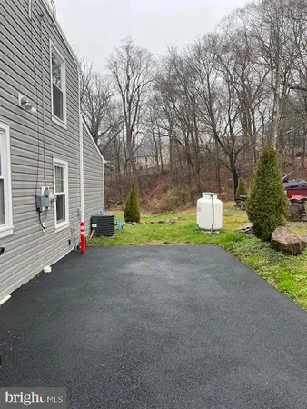 a bedroom with double bed and a window