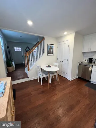 a bathroom with a sink toilet and mirror
