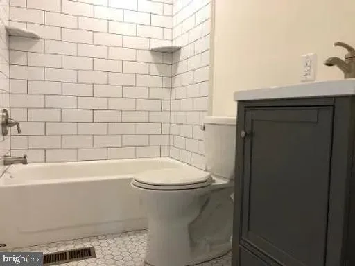 a bathroom with a sink and toilet