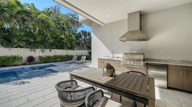 a spacious bathroom with a tub sink and mirror