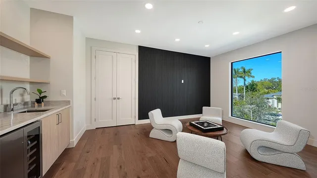 a swimming pool with outdoor seating and yard