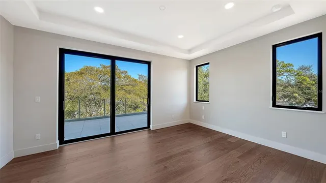a bedroom with furniture and a potted plant