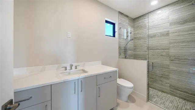 a view of a patio with table and chairs potted plants with wooden fence