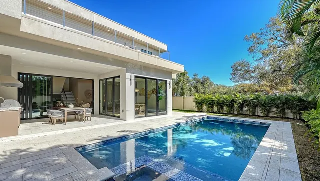 an aerial view of a houses with a lake view