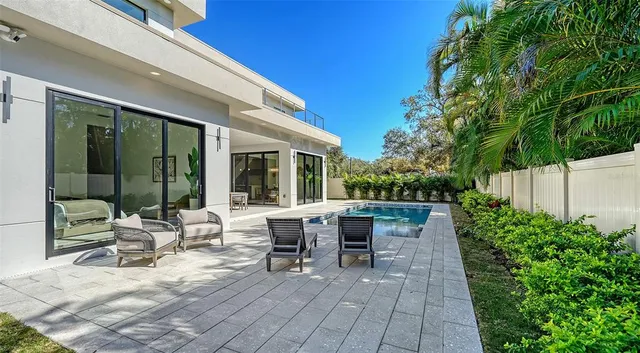 an aerial view of residential building and lake