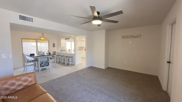 a view of an empty room and a window