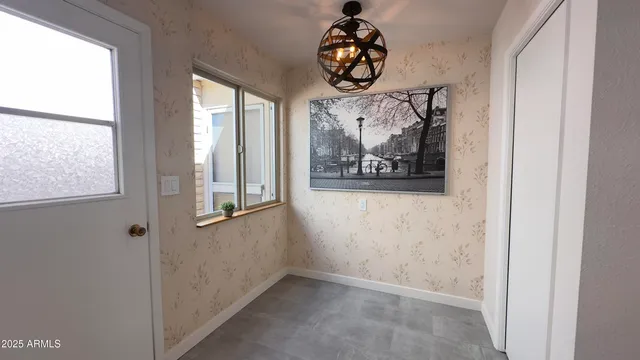 a kitchen that has a sink a stove and cabinets