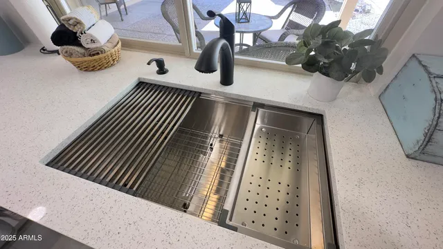 a kitchen that has a sink and a stove