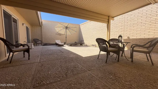 a view of living room with furniture and wooden floor