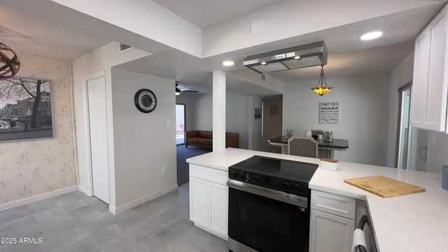 a kitchen with a sink and a refrigerator
