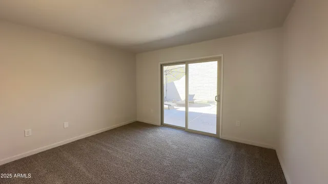 a bathroom with a toilet sink double vanity and mirror