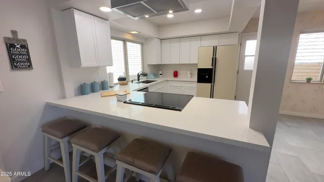 a view of kitchen with cabinets and wooden floor