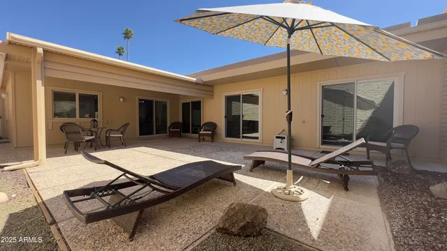 a room with gym equipment and view of living room