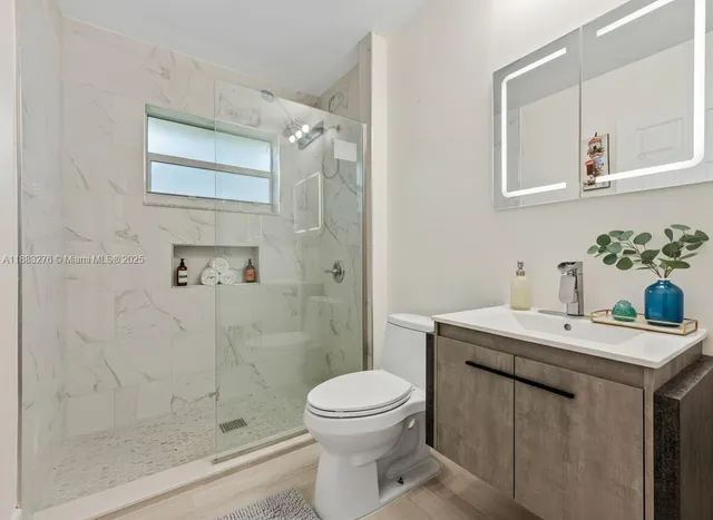 a living room with a bed and a dresser